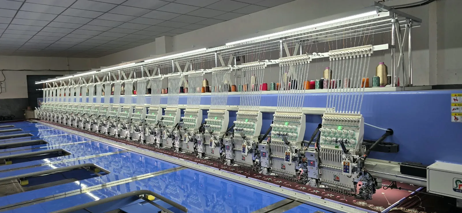 Long multi-head embroidery machine line
