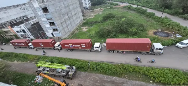 Container trucks on the way to site