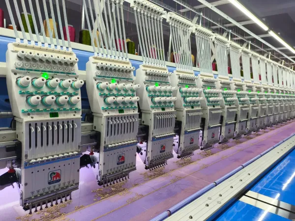 Flat embroidery heads in a row